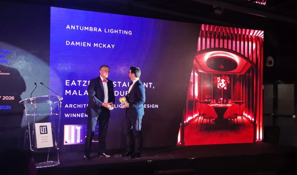 Damien McKay receiving a LIT Lighting Design Award in Paris.